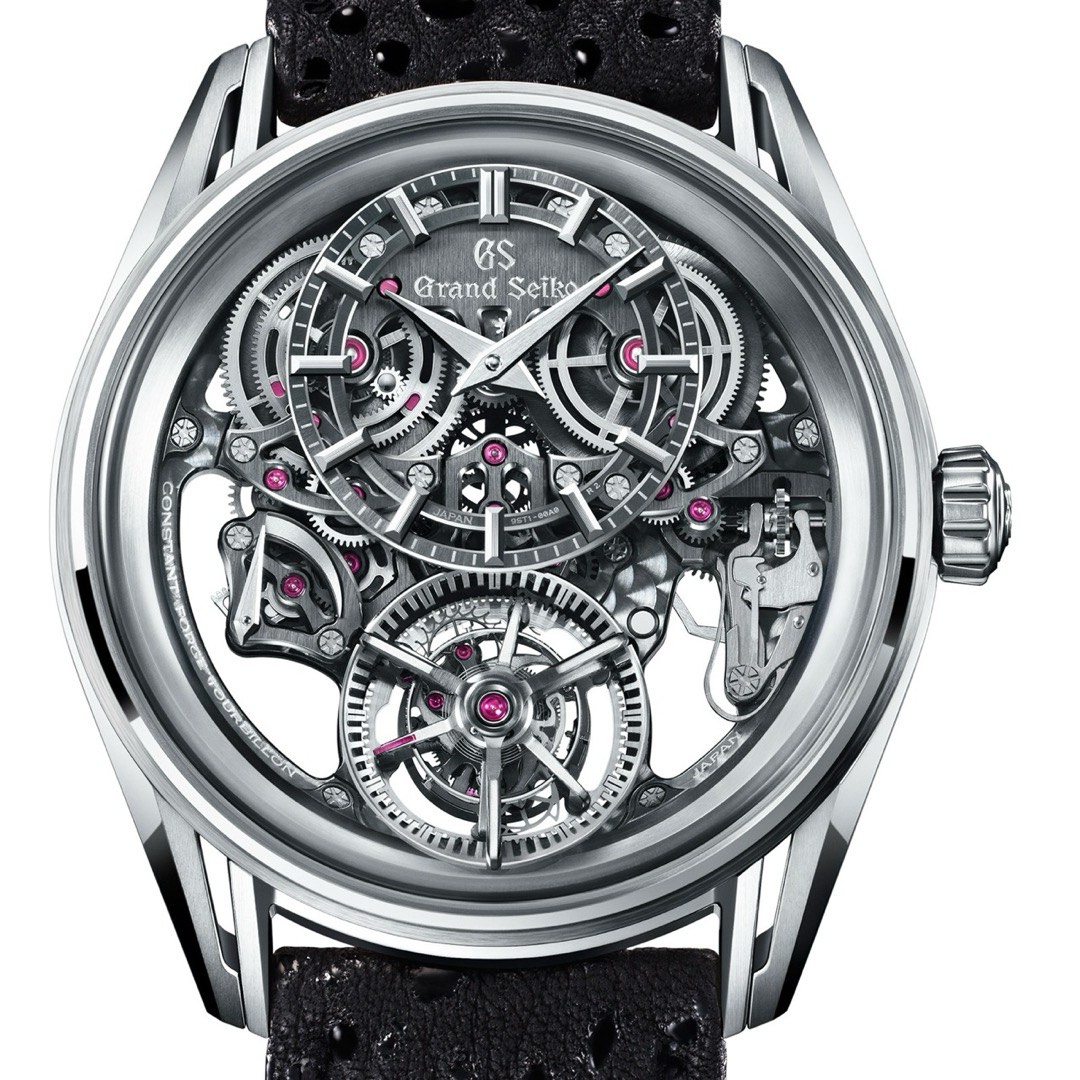The Grand Seiko Kodo Constant-Force Tourbillon seen dial side, its openworked dial revealing a toothed carriage at six with a five spoke bridge and the balance turning inside it
