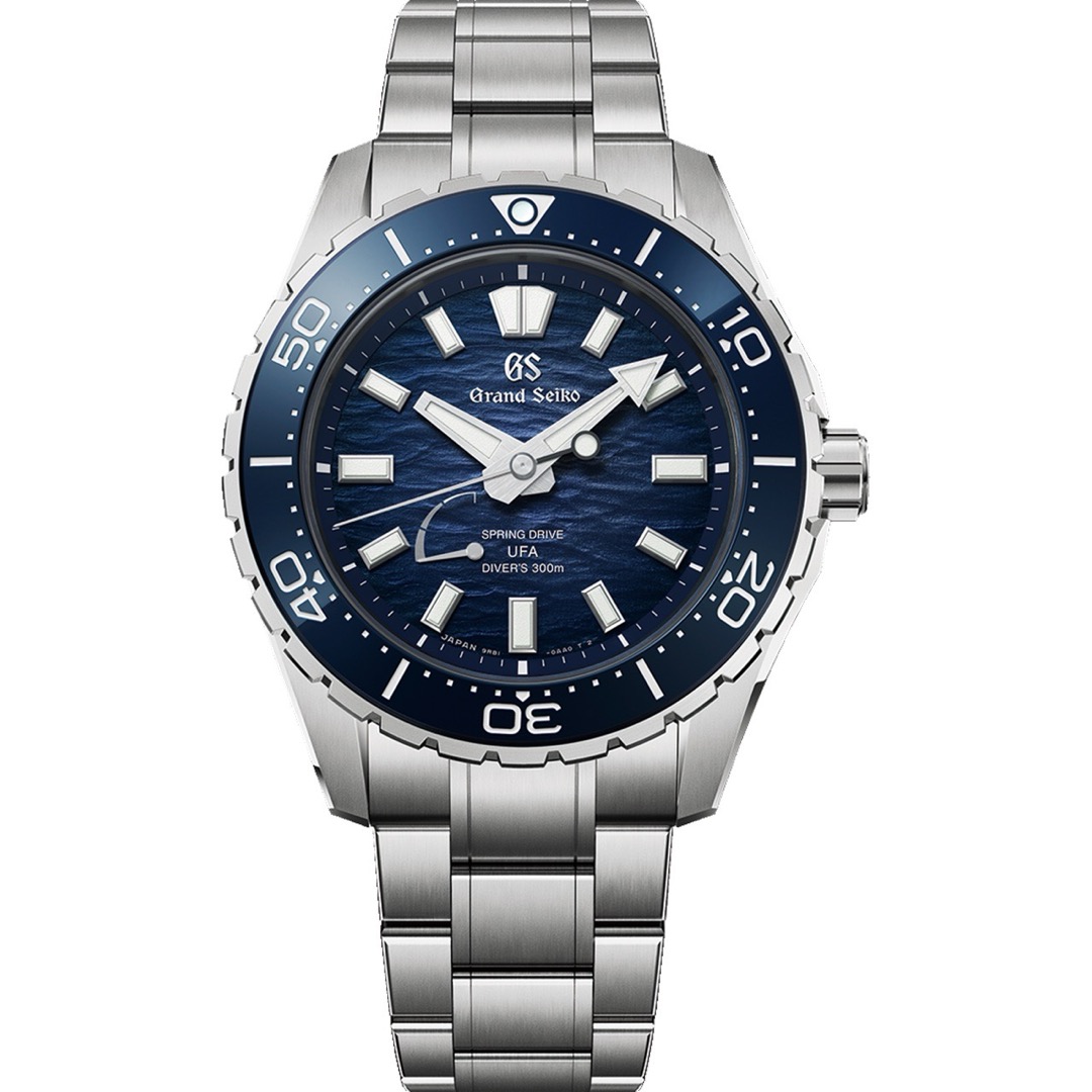 A Grand Seiko SLGB023 seen head on, a 300 metre diver with a blue rotating bezel and a marine blue dial rippled like water, printed Spring Drive UFA
