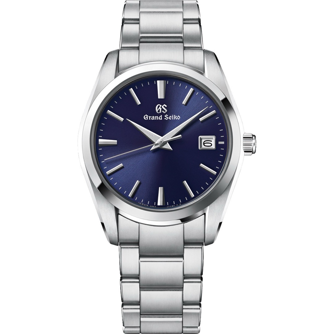 A Grand Seiko SBGX265 seen head on, its deep sunray blue dial darkening toward the rim, with faceted steel batons, a date window at three and a three link steel bracelet